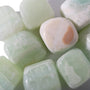 Pistachio Green Calcite Tumbled Stones from Stonebridge Imports