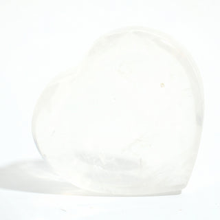Clear Quartz Heart Bowl, a shallow heart-shaped dish carved from milky translucent clear quartz with soft internal veils, photographed on a clean white background. Stonebridge Imports.