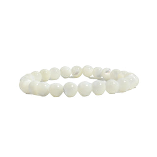 Shell White Round Bracelet - 8mm seen edge on, showing the creamy banding and lustre of the polished shell beads, on a clean white background. Stonebridge Imports.