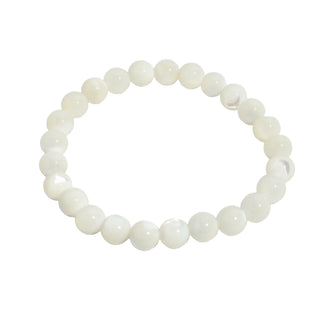 Shell White Round Bracelet with 8 mm polished natural white shell beads on stretch cord, laid flat and photographed on a clean white background. Stonebridge Imports.