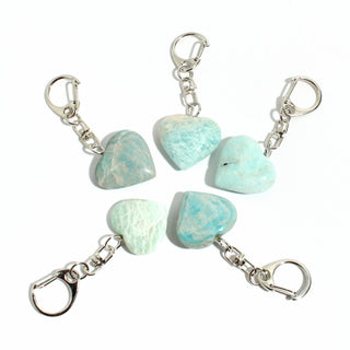 Amazonite Heart Charm - Pack of 5 - five polished turquoise amazonite hearts, each on its own silver-tone swivel clasp, arranged on a clean white background. Stonebridge Imports.