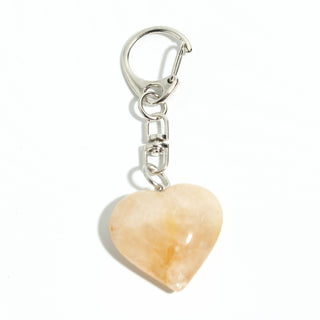 Golden Healer Heart Charm - Pack of 5 - a single polished peach-gold golden healer heart from the pack on its silver-tone swivel clasp and keyring, photographed on a clean white background. Stonebridge Imports.