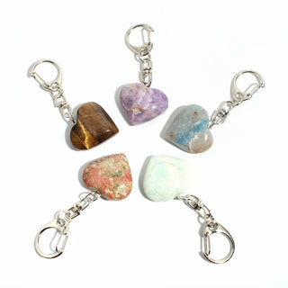 Mixed Stone Heart Charm - Pack of 5 - five polished hearts in tiger eye, amethyst, amazonite and unakite, each on a silver-tone swivel clasp, on a clean white background. Stonebridge Imports.