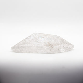 Clear Quartz Free Form Unique #2, a polished clear quartz free-form polished point shown from an alternate angle on a clean white background. Stonebridge Imports.