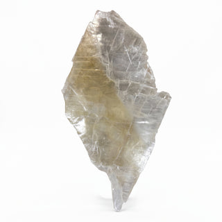 Selenite Window Slab Unique #21 - 32", a large diamond-shaped slab with a warm golden-tan core and fine parallel striations, photographed on a clean white background. Stonebridge Imports.