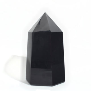 Black Obsidian Generator Unique #4 — polished six-sided tower with a faceted point, seen from a second angle, photographed on a clean white background. Stonebridge Imports.