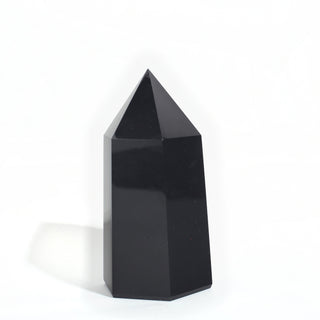 Black Obsidian Generator Unique #7 — polished six-sided tower with a faceted point, seen from a second angle, photographed on a clean white background. Stonebridge Imports.