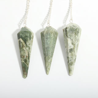 Vessonite Pendulum 6 Facet & Bead - 3 Pack, three mottled green vessonite pendulums hanging side by side on a clean white background. Stonebridge Imports.