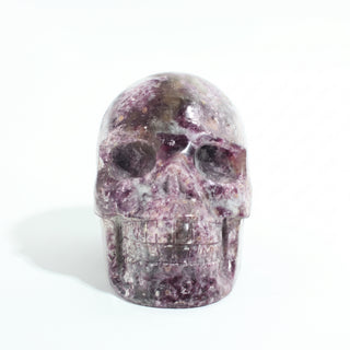 Lepidolite Skull Carving Unique #9, alternate angle photographed on a clean white background. Stonebridge Imports.