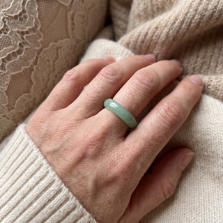 Green Aventurine Ring worn on the hand in natural light, showing the solid soft green aventurine band at true scale.