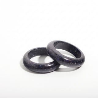 Blue Goldstone Ring (Enhanced) — solid deep blue goldstone with fine sparkle stone band ring, photographed on a clean white background. Stonebridge Imports.