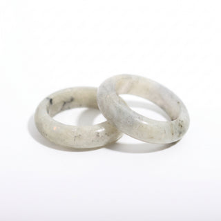 Labradorite Ring — solid grey labradorite with blue flash stone band ring, photographed on a clean white background. Stonebridge Imports.