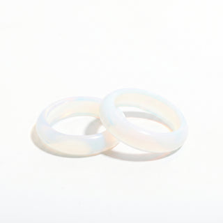 Opalite Ring — solid milky blue-white opalite stone band ring, photographed on a clean white background. Stonebridge Imports.