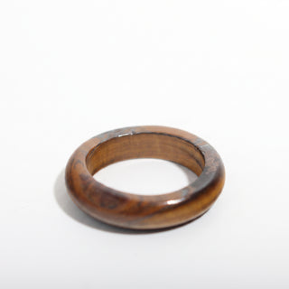 Tiger Eye Ring — solid golden-brown banded tiger eye stone band ring, alternate angle photographed on a clean white background. Stonebridge Imports.