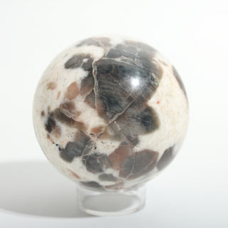 Medium #1 — Chocolate Labradorite Sphere, cream stone with smoky brown-grey labradorite patches, alternate side, photographed on a clean white background. Stonebridge Imports.