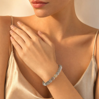 Druzy Agate bead bracelet worn with the hand resting on the chest