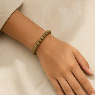 Gold Druzy Agate bead bracelet worn on the wrist, close-up