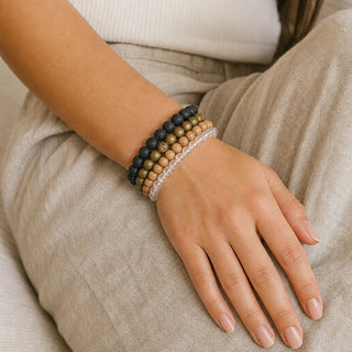 Gold Druzy Agate bead bracelet stacked with other bead bracelets on the wrist