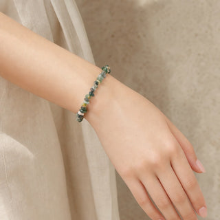 Moss Agate bead bracelet worn on the wrist, close-up