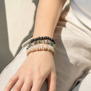 Moss Agate bead bracelet stacked with other bead bracelets on the wrist
