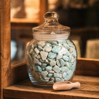Amazonite B Tumbled Stones - Semi Polished in a glass apothecary jar with a scoop