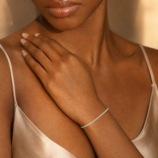 Amazonite bead bracelet worn with the hand resting on the chest