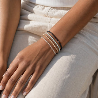 Amazonite bead bracelet stacked with other bead bracelets on the wrist