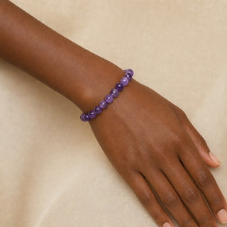 Amethyst bead bracelet worn on the wrist, close-up