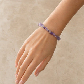 Dark Amethyst bead bracelet worn on the wrist, close-up