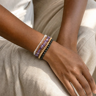 Dark Amethyst bead bracelet stacked with other bead bracelets on the wrist