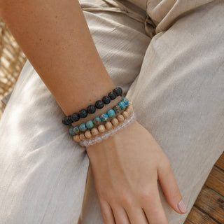 Blue Impression Jasper bead bracelet stacked with other bead bracelets on the wrist