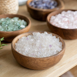 Clear Quartz A Tumbled Stones - Assorted in a wooden bowl on a boutique display table