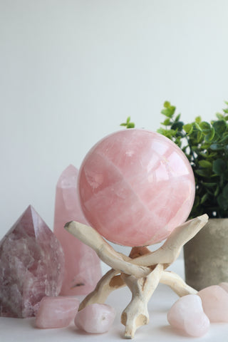 Rose quartz sphere on a stand