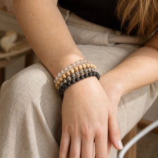 Dalmatian Jasper bead bracelet stacked with other bead bracelets on the wrist