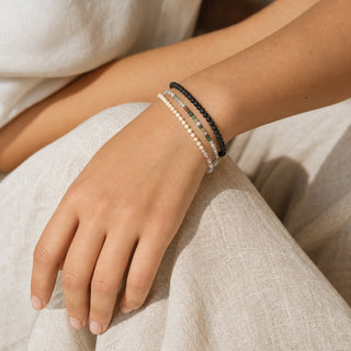 Indian Agate bead bracelet stacked with other bead bracelets on the wrist