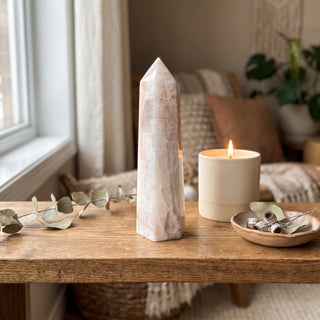 Moonstone Generator Unique #1 - 6" displayed on a wooden home altar shelf beside a candle, shown at true size in warm natural light.