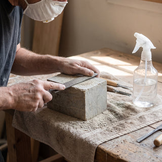 6x6x6 Carving Block - carving soapstone over a damp towel to keep dust down