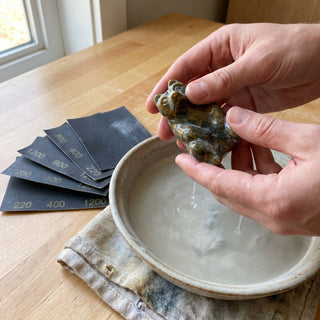 Pink Soapstone Rough (per lb) - wet-sanding a soapstone carving