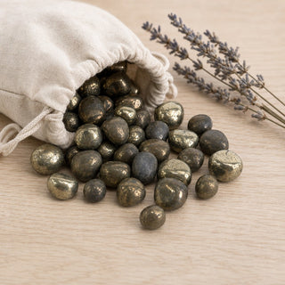 Pyrite Iron Matrix Tumbled Stones - India spilling from a linen pouch