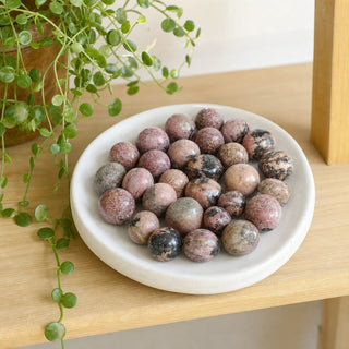Rhodonite Dark Tumbled Stones from Stonebridge Imports