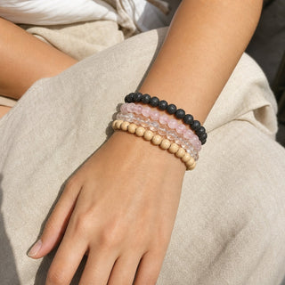 Rose Quartz bead bracelet stacked with other bead bracelets on the wrist
