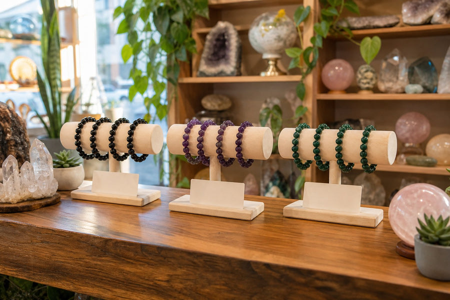 Bead bracelets on wooden stands in a crystal shop
