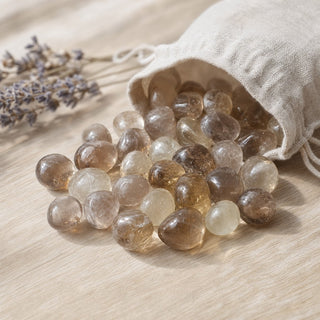 Smoky Quartz Tumbled Stone - Light/Dark spilling from a linen pouch
