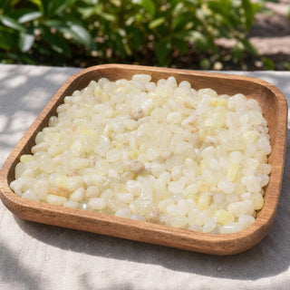 Sulfur Quartz Tumbled Stones - Mini in a wooden tray at a market stall