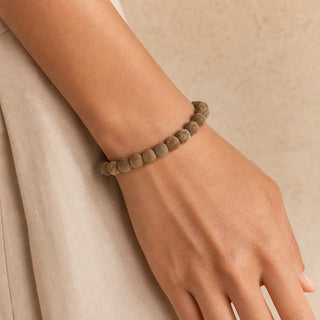 Wood Jasper bead bracelet worn on the wrist, close-up